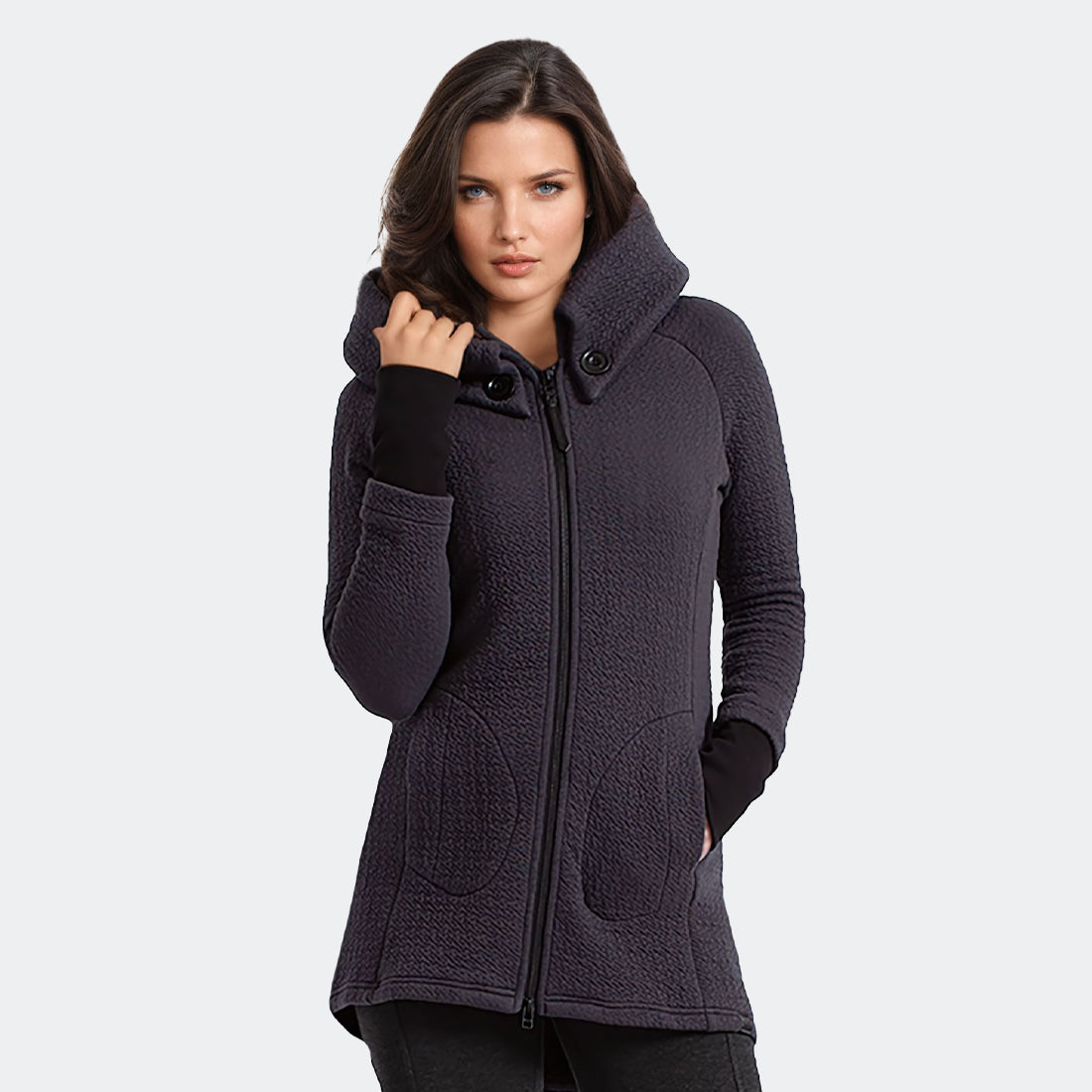 Front view of the Maggie Coat in Uniquilt Charcoal textured jacquard, showing the hood buttons, zipper, pockets and black rib cuffs.