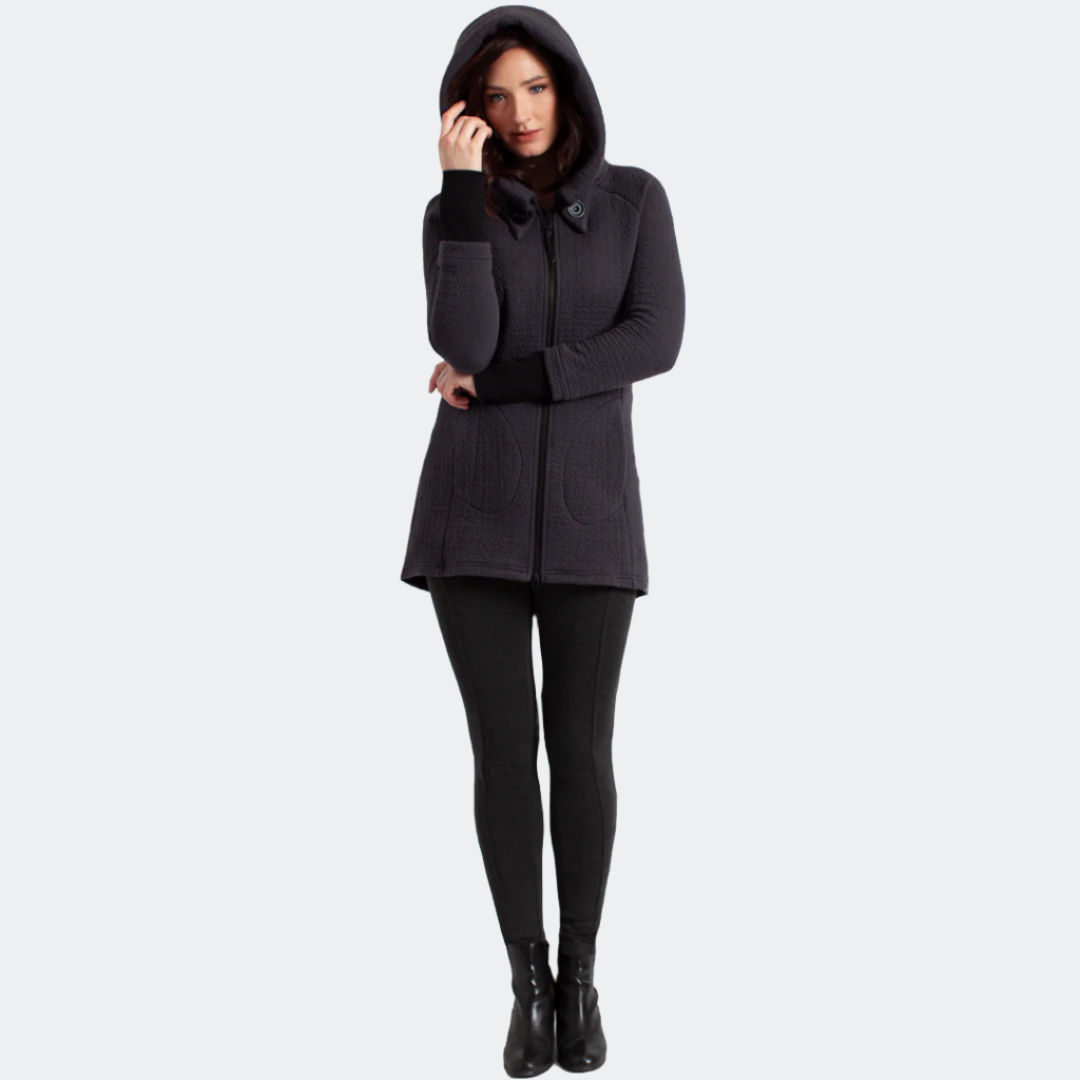 Full-length front view of a model wearing the Maggie Uniquilt Charcoal coat zipped up with the hood raised.